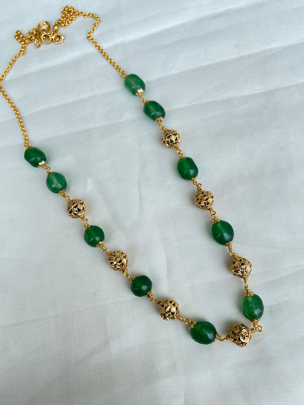 Green round beads with gold nakshi balls short size