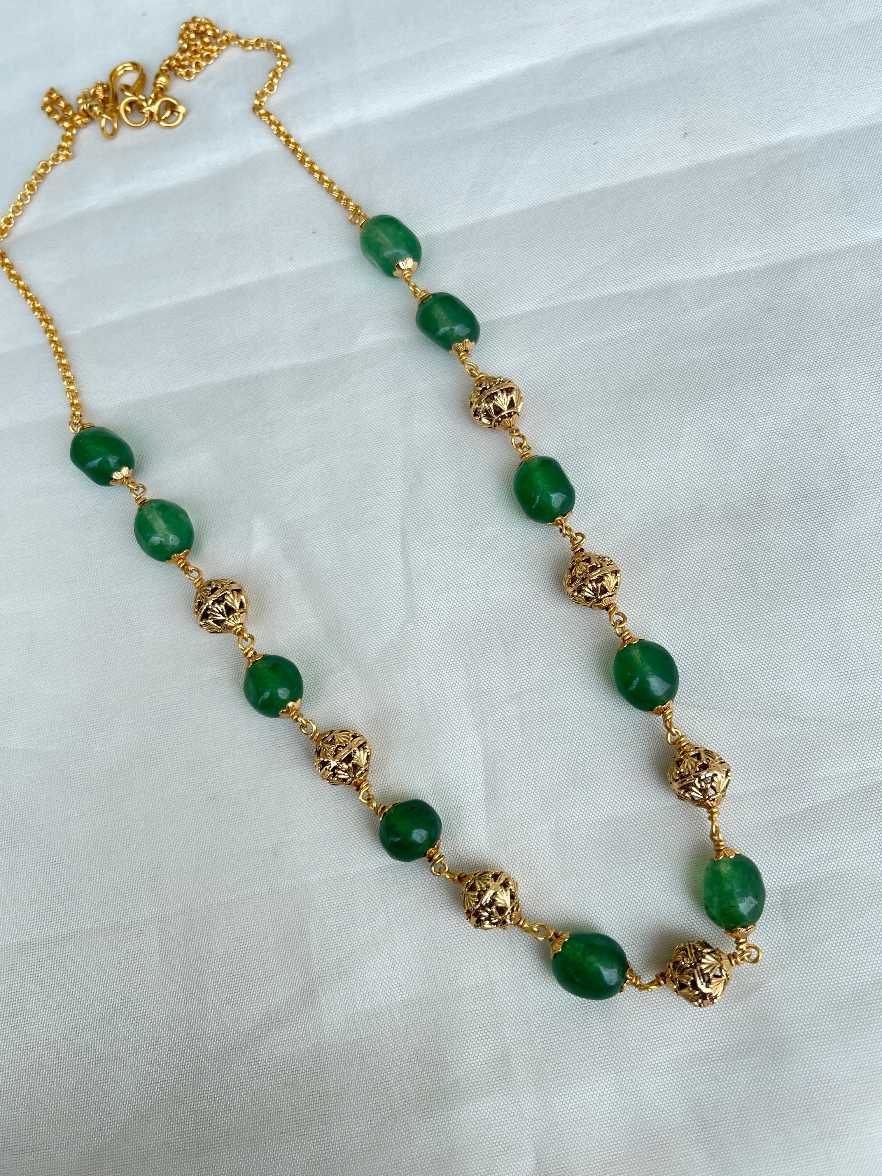 Green round beads with gold nakshi balls short size