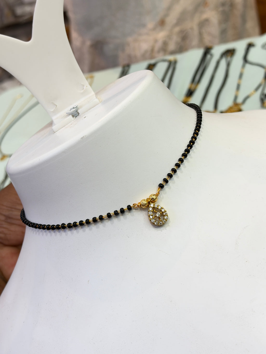 15 stones oval center stone Black beads 18 inches BB414