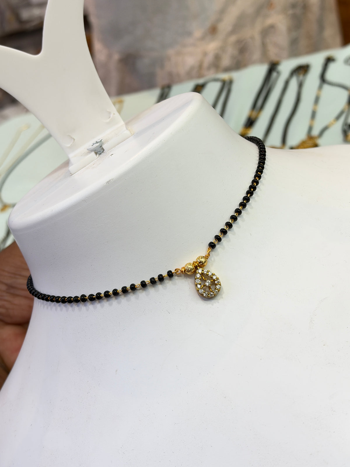 15 stones oval center stone Black beads 18 inches BB414