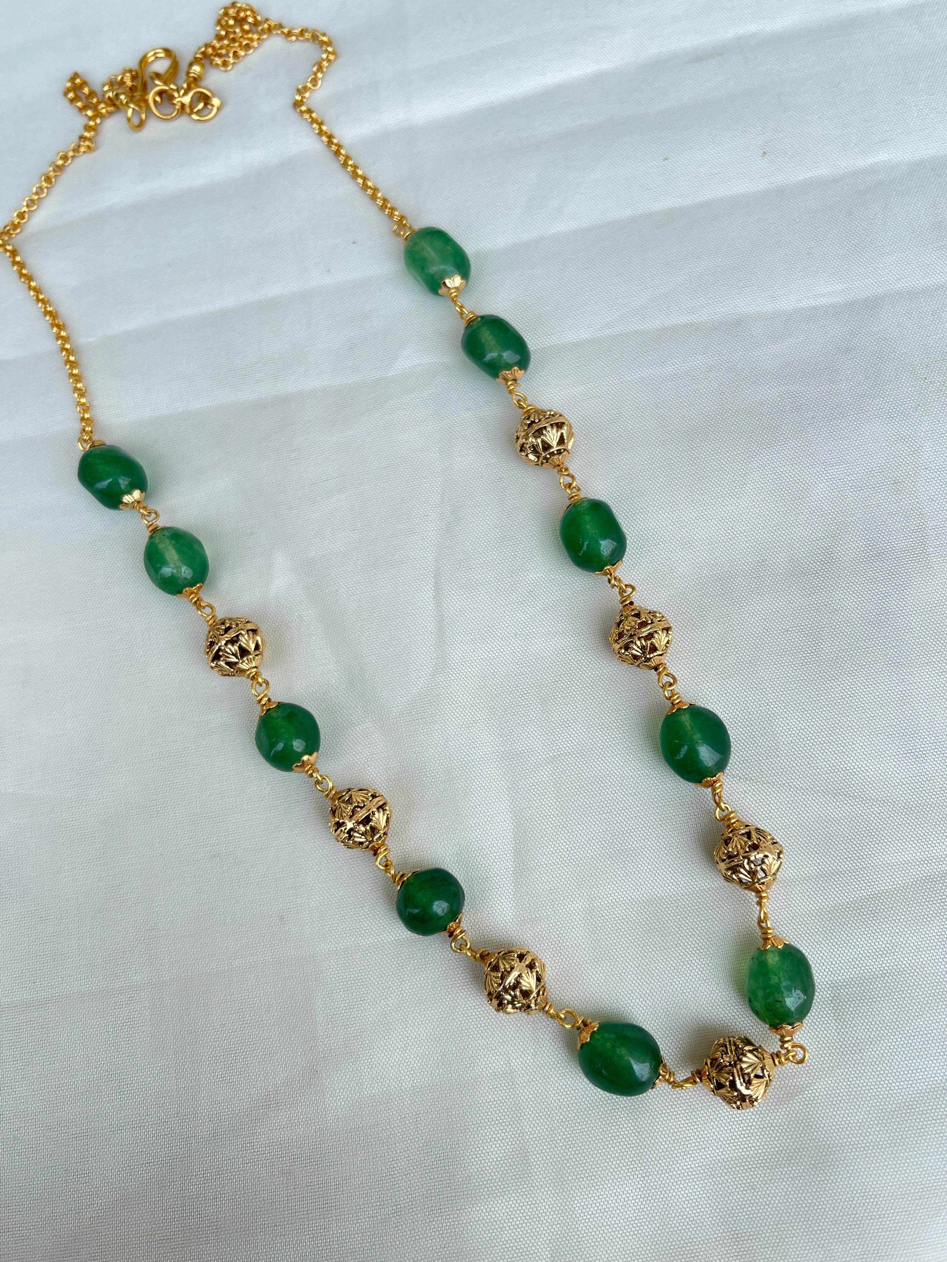 Green round beads with gold nakshi balls short size