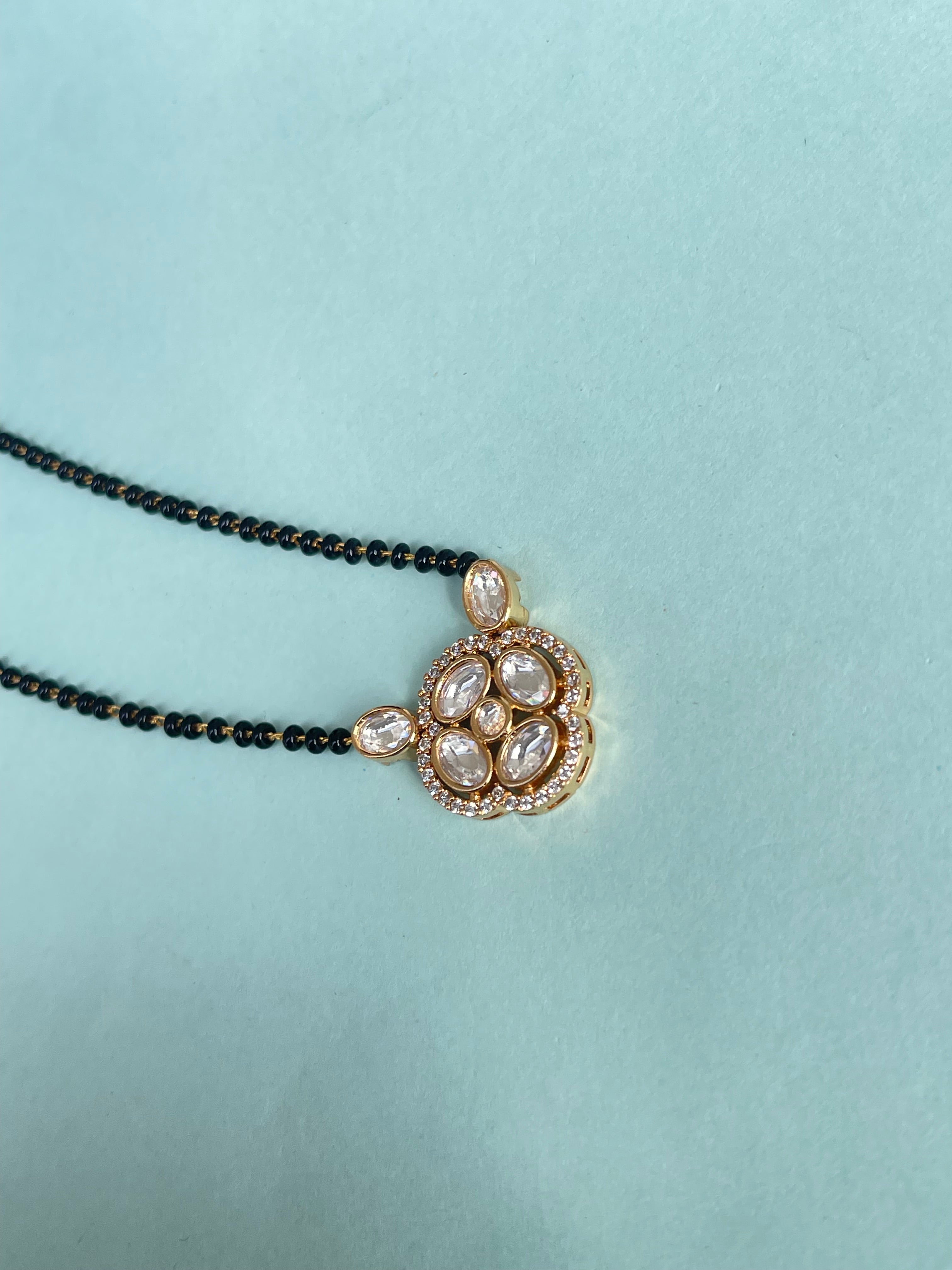 Kundan pendant and earrings single line 18 inches blackbeads bb501