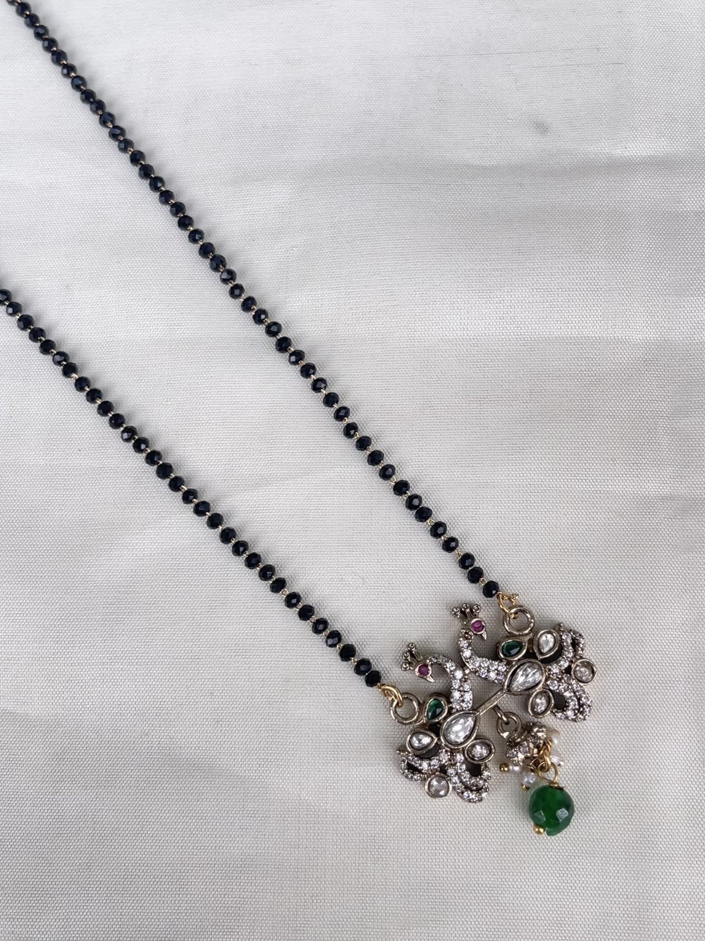 Single line blackbeads with peakock pendent bb1712